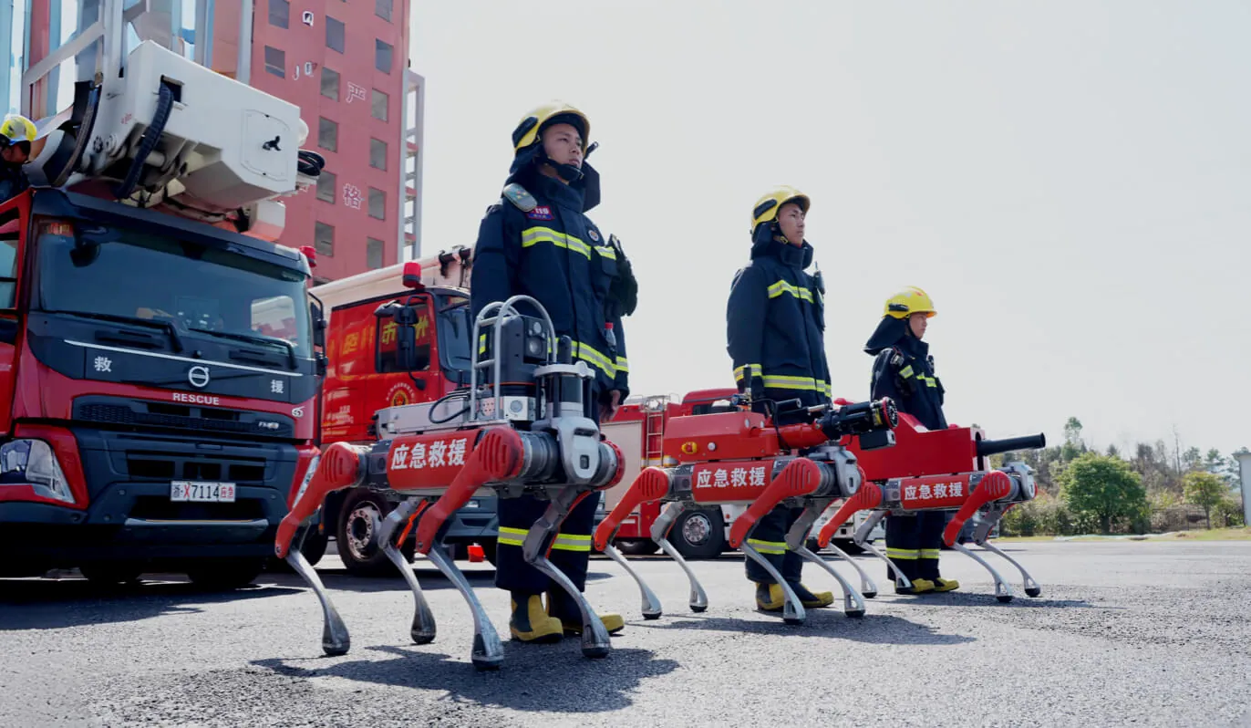 Unitree quadrupeds at a fire-rescue site: scaled non-factory deployment